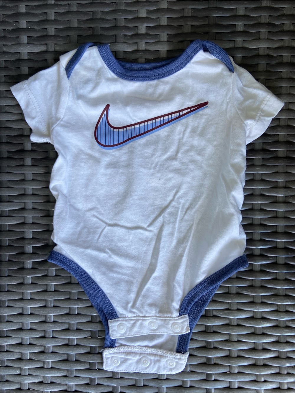 Nike White One-Piece Bodysuit with Blue Trim and Maroon-Accented Swoosh